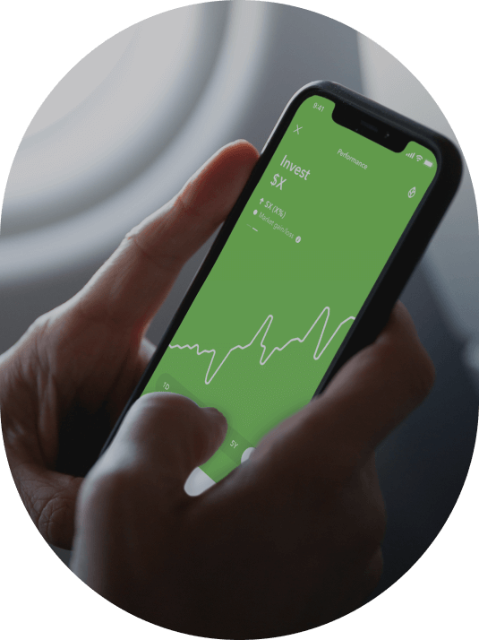 Hands holding phone with Acorns app