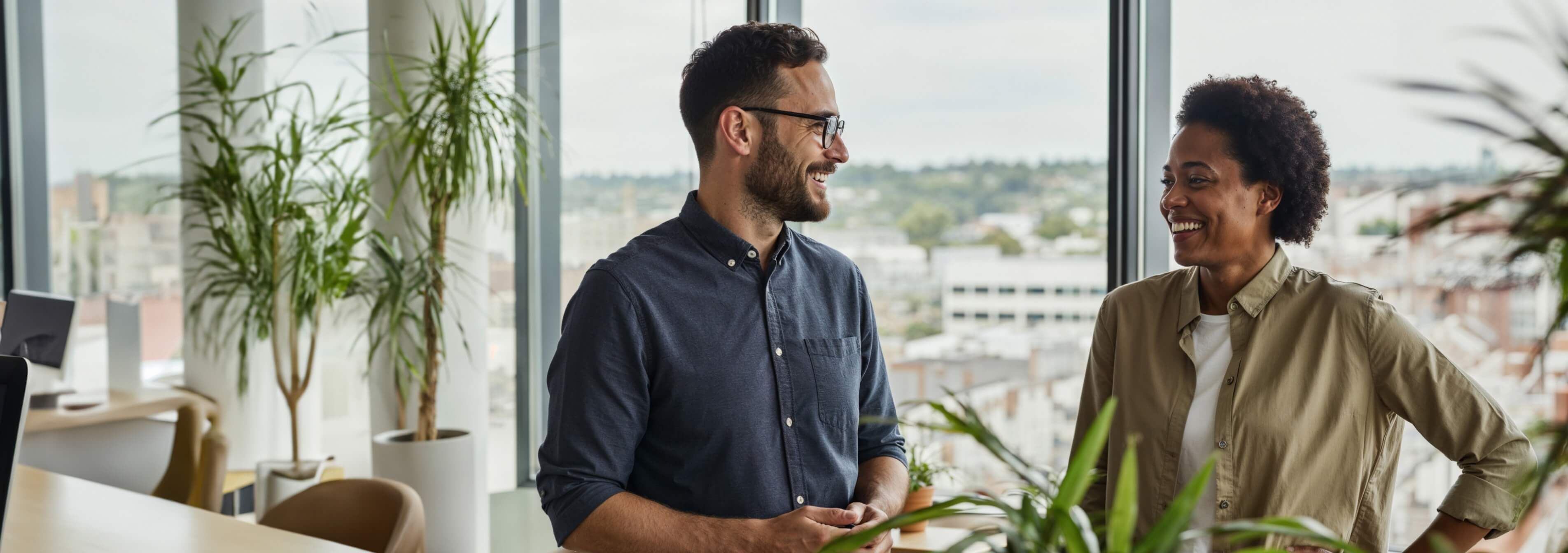 man and woman talking in office
